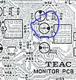 monitor pcb closeup capacitors w circle.webp