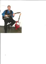 Phil playing guitar.webp