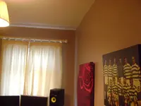 Right corner behind speaker.webp