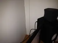 Corner behind right monitor.webp