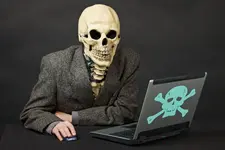 Skeleton-at-computer.webp