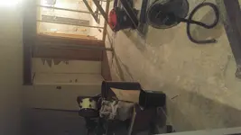 View of existing bottom of stairway door.webp
