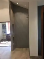 Curbless Walk-In Shower with Recessed Niches-Glass Shelves and Accent Lighting.webp